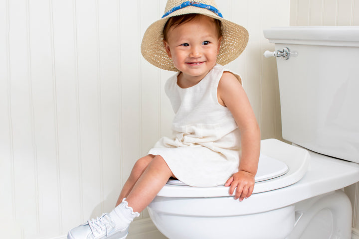 Smiling Toddler Sitting on Potty Proud Seat