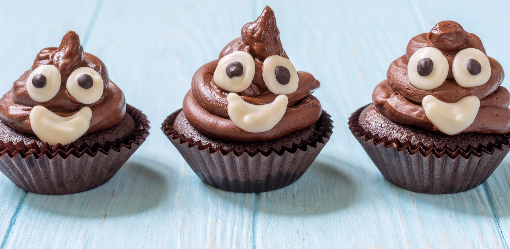 brown cupcakes that look like smiling poops