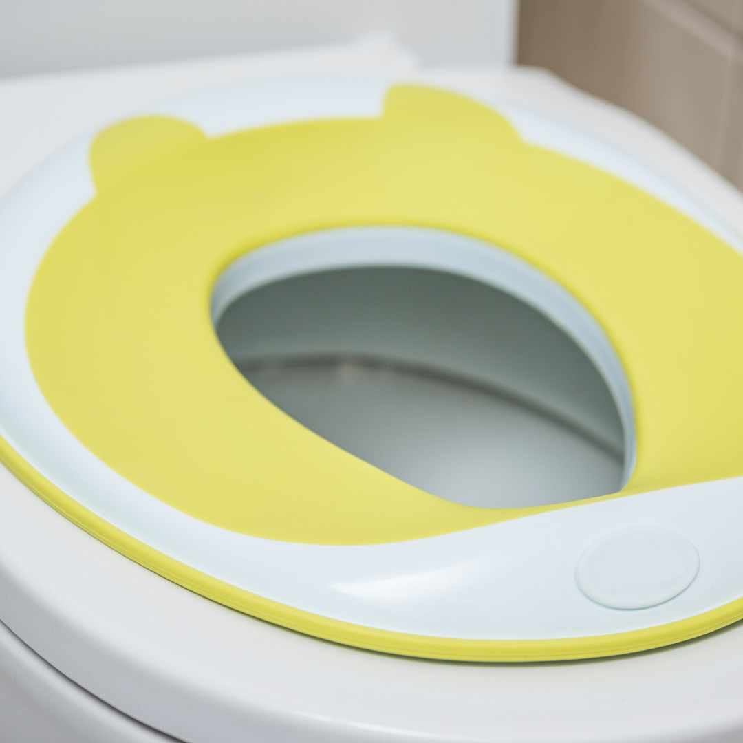boy sitting on travel potty